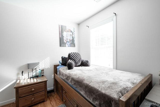 bedroom featuring wood finished floors
