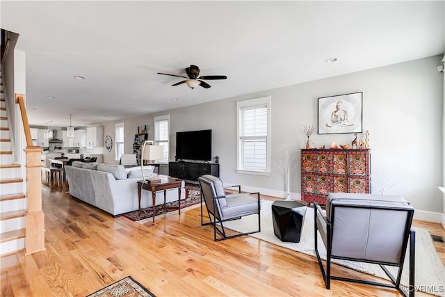 1207 N 21st St, Richmond, VA 23223 - living area with ceiling fan, recessed lighting, baseboards, light wood-type flooring, and stairway
