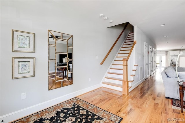 1207 N 21st St, Richmond, VA 23223 - stairway with baseboards and wood finished floors