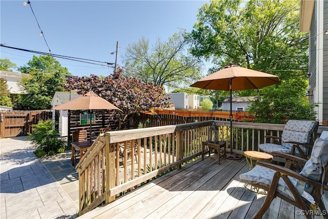 1207 N 21st St, Richmond, VA 23223 - deck with a patio and a fenced backyard