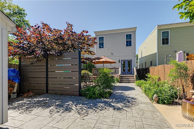 1207 N 21st St, Richmond, VA 23223 - view of front of property featuring a patio, fence, and a wooden deck