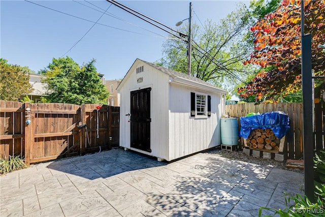 1207 N 21st St, Richmond, VA 23223 - view of shed with a fenced backyard and a gate