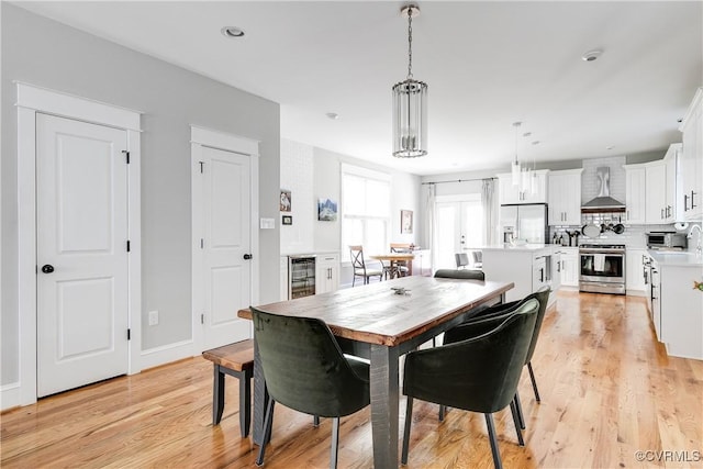 1207 N 21st St, Richmond, VA 23223 - dining space with beverage cooler, recessed lighting, and light wood-style flooring
