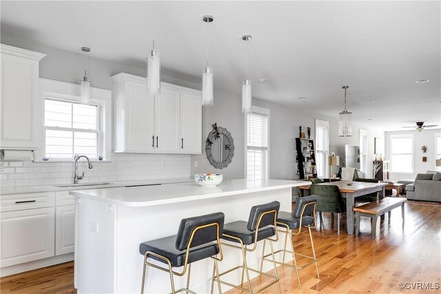 1207 N 21st St, Richmond, VA 23223 - kitchen with a sink, plenty of natural light, white cabinets, and open floor plan