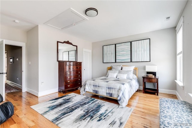 1207 N 21st St, Richmond, VA 23223 - bedroom featuring multiple windows, attic access, light wood-style flooring, and visible vents