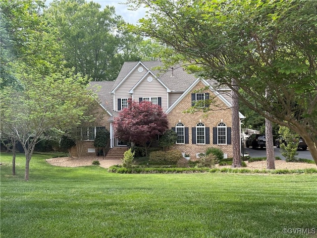 7324 Rosemead Ln, Chesterfield, VA 23838 - traditional-style house with brick siding, a front lawn, and roof with shingles