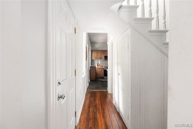hallway featuring dark wood-style flooring