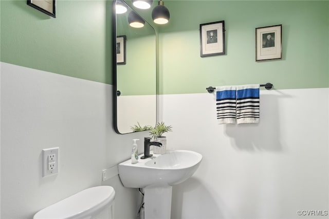 bathroom with a sink and toilet