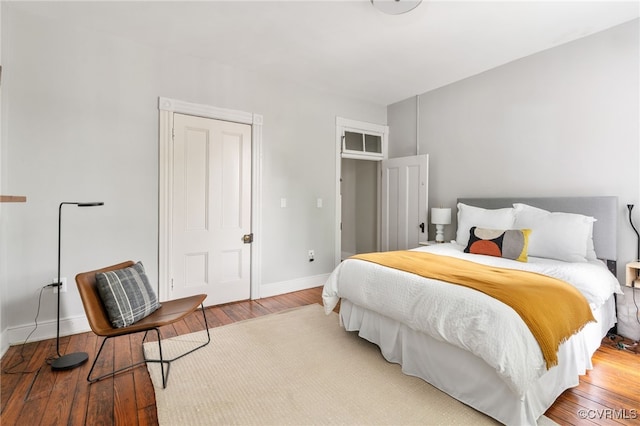 bedroom featuring baseboards and light wood-style floors