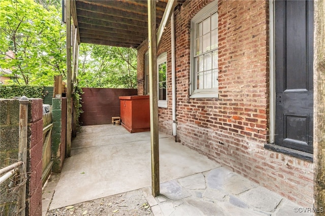 view of patio / terrace featuring fence