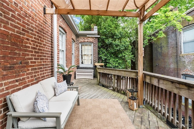 view of patio with outdoor lounge area and a wooden deck