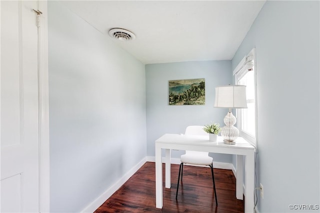 office with baseboards, dark wood finished floors, and visible vents
