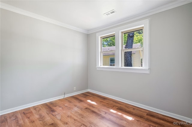 1207 Edgewood Blvd, Hopewell, VA 23860 - empty room featuring crown molding, baseboards, visible vents, and wood finished floors