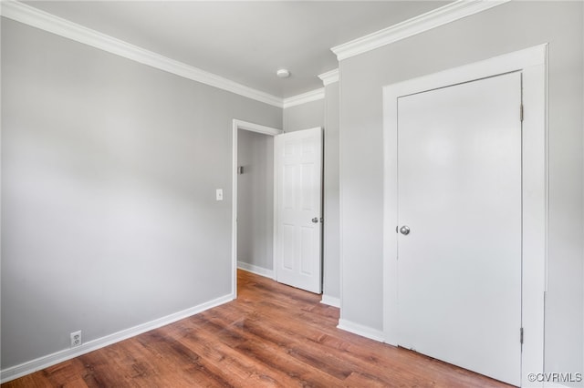 1207 Edgewood Blvd, Hopewell, VA 23860 - unfurnished bedroom with baseboards, ornamental molding, and wood finished floors