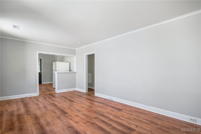 1207 Edgewood Blvd, Hopewell, VA 23860 - unfurnished room featuring crown molding, baseboards, visible vents, and wood finished floors