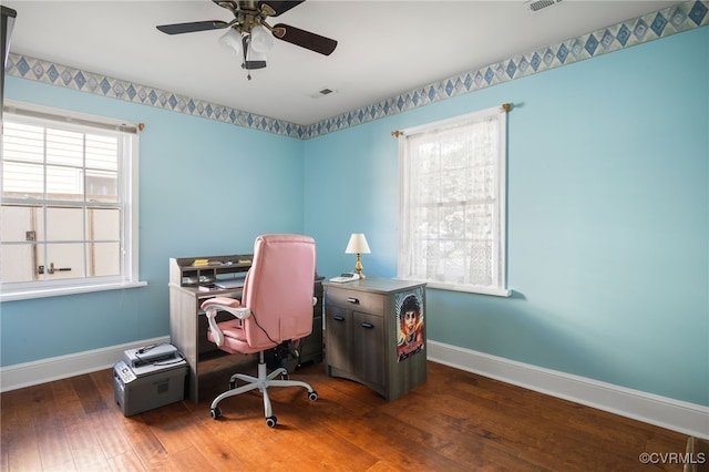 office with baseboards, ceiling fan, hardwood / wood-style flooring, and visible vents