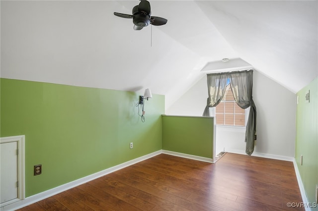 bonus room with baseboards, ceiling fan, vaulted ceiling, and hardwood / wood-style floors