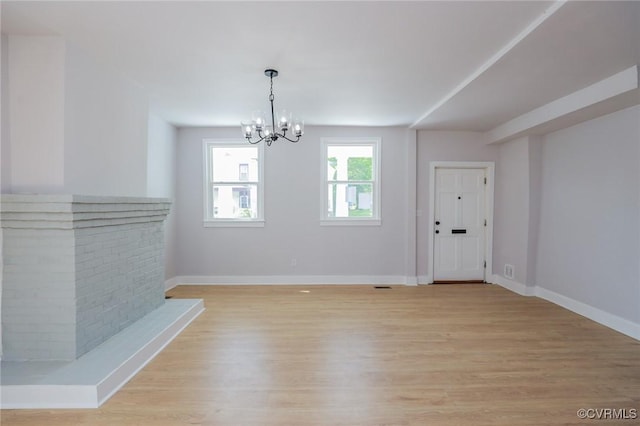2014 Dinwiddie Ave, Richmond, VA 23224 - unfurnished dining area featuring a chandelier and light wood-style flooring