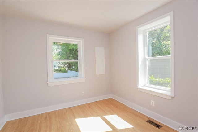 2014 Dinwiddie Ave, Richmond, VA 23224 - unfurnished room featuring light wood finished floors and baseboards