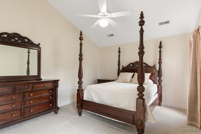 bedroom with baseboards, light carpet, visible vents, and vaulted ceiling