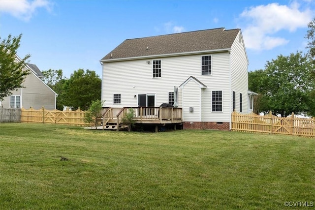 back of property featuring a fenced backyard, a deck, a shingled roof, and a lawn