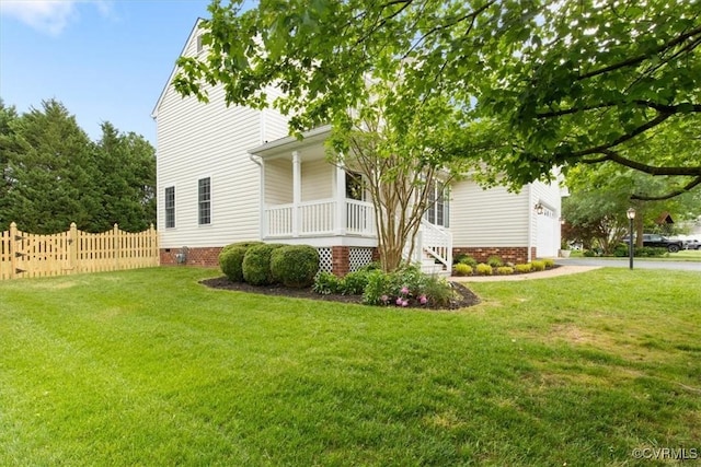 view of home's exterior with covered porch, fence, crawl space, and a lawn