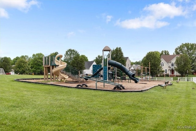 communal playground featuring a yard