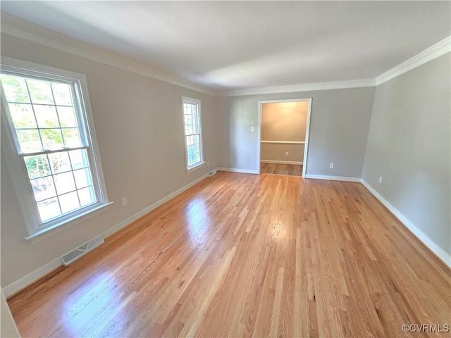 8600 Chester Forest Ln, North Chesterfield, VA 23237 - spare room featuring visible vents, light wood finished floors, crown molding, and a healthy amount of sunlight