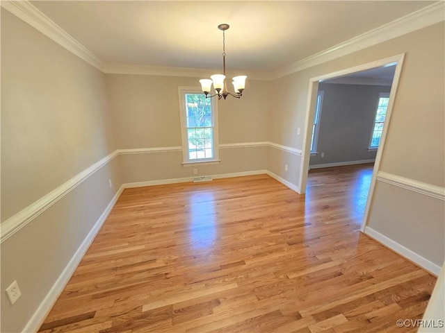 8600 Chester Forest Ln, North Chesterfield, VA 23237 - unfurnished dining area featuring crown molding, a notable chandelier, light wood-style flooring, and visible vents