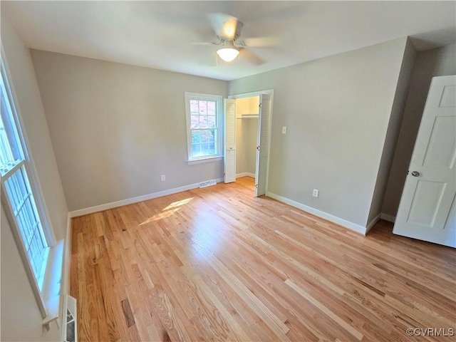 8600 Chester Forest Ln, North Chesterfield, VA 23237 - unfurnished bedroom with baseboards, ceiling fan, light wood-style flooring, and visible vents