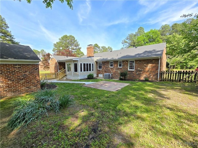 8600 Chester Forest Ln, North Chesterfield, VA 23237 - back of property with brick siding, cooling unit, fence, and a chimney