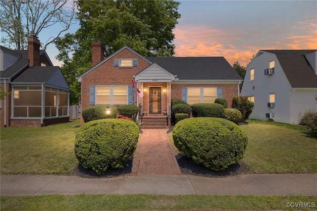 3006 Douglasdale Rd, Richmond, VA 23221 - bungalow-style house featuring a sunroom, brick siding, a chimney, and a front yard
