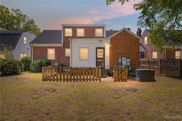 3006 Douglasdale Rd, Richmond, VA 23221 - back of property featuring brick siding, central AC, fence, and a yard