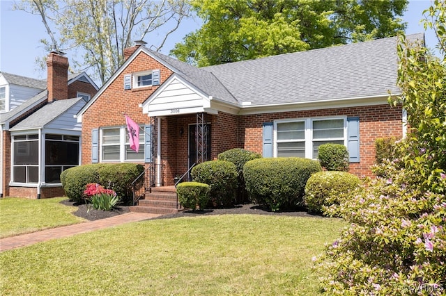 3006 Douglasdale Rd, Richmond, VA 23221 - bungalow-style house with brick siding, roof with shingles, and a front lawn