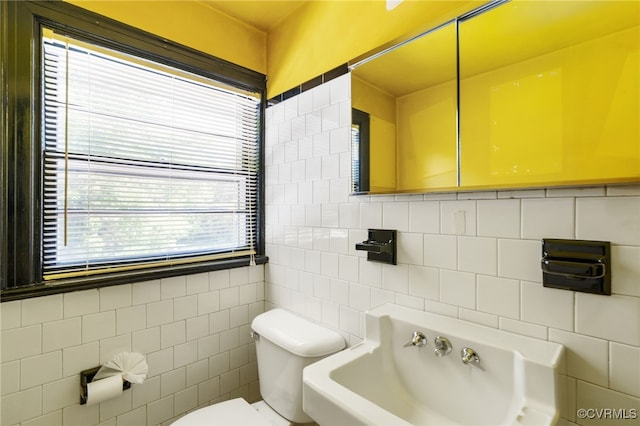 3006 Douglasdale Rd, Richmond, VA 23221 - half bathroom with toilet, a sink, tile walls, and a wealth of natural light