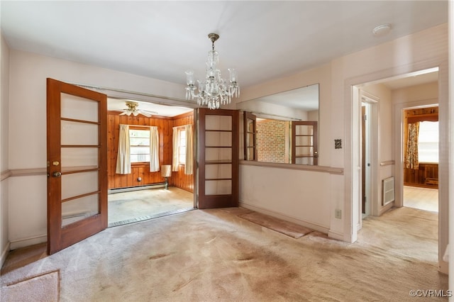 3006 Douglasdale Rd, Richmond, VA 23221 - empty room featuring baseboards, a baseboard radiator, carpet, and ceiling fan with notable chandelier