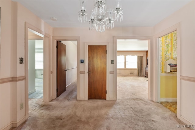 3006 Douglasdale Rd, Richmond, VA 23221 - corridor featuring an inviting chandelier, carpet, and baseboards