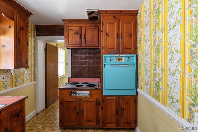 3006 Douglasdale Rd, Richmond, VA 23221 - kitchen with white electric cooktop, brown cabinets, baseboards, wallpapered walls, and oven