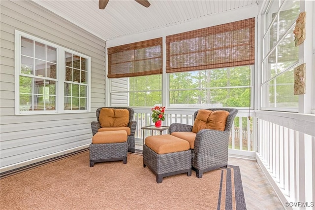 sunroom featuring a ceiling fan