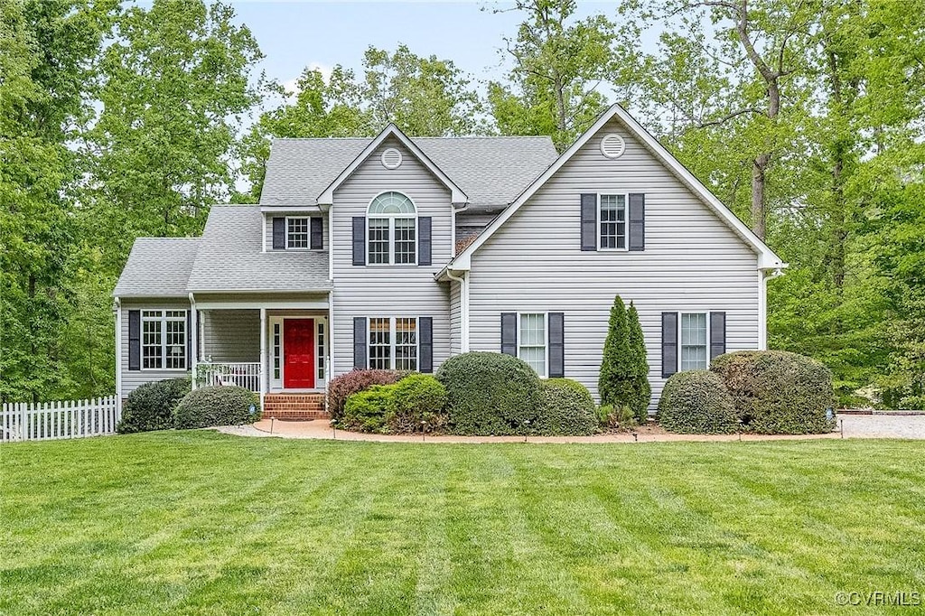 3937 Olde Links Ct, Powhatan, VA 23139 - view of front of home with fence, roof with shingles, and a front yard