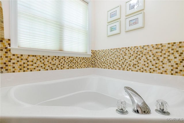 bathroom with a garden tub
