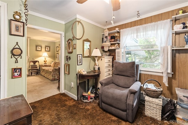 sitting room featuring crown molding, carpet flooring, and ceiling fan