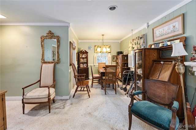 sitting room featuring carpet floors, ornamental molding, baseboards, and a chandelier