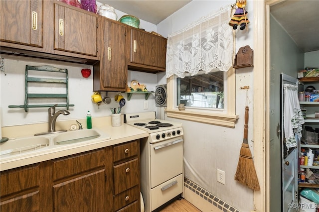 kitchen featuring visible vents, open shelves, white electric range, a sink, and light countertops