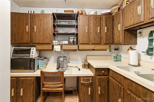 kitchen with light countertops and a sink