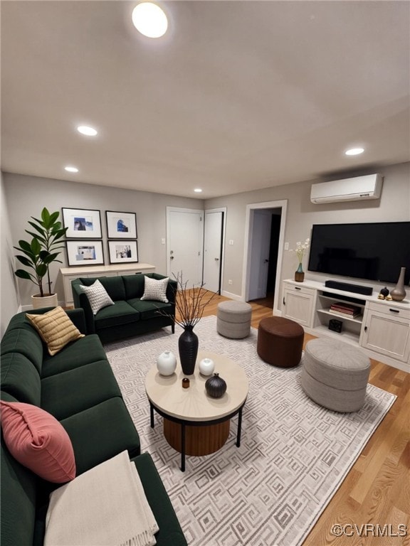 4018 Forest Hill Ave Unit U7, Richmond, VA 23225 - living room featuring light wood finished floors, a wall unit AC, and recessed lighting