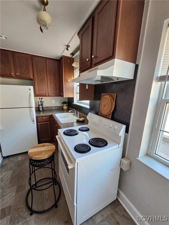 4018 Forest Hill Ave Unit U7, Richmond, VA 23225 - kitchen with white appliances, a sink, under cabinet range hood, and plenty of natural light