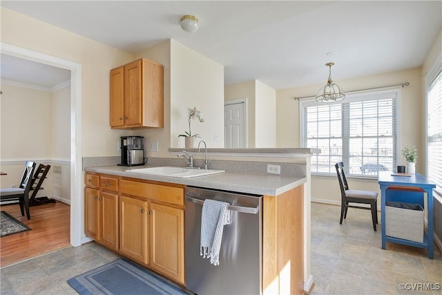 kitchen with dishwasher, a sink, baseboards, light countertops, and a peninsula