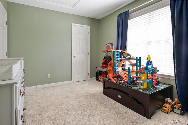 rec room featuring baseboards and carpet flooring
