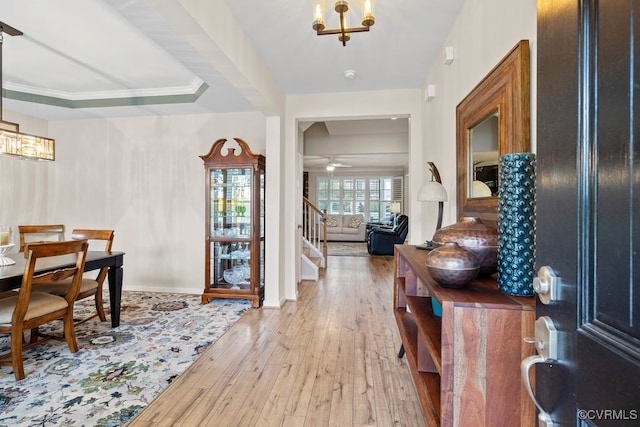 15501 Wolfboro Rd, Chesterfield, VA 23832 - foyer entrance featuring baseboards, light wood-style flooring, stairway, and ceiling fan with notable chandelier